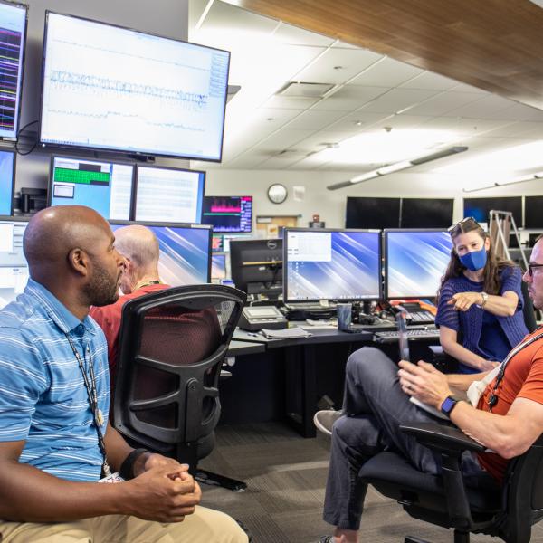 At left is physicist Dorian Bohler. Staff gathered in Bldg 52's main control room on October 6, 2022 in anticipating seeing the first electrons from LCLS-II. 