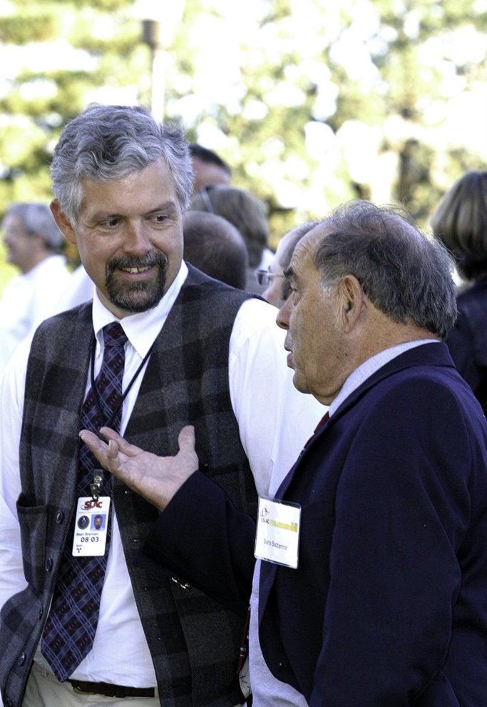 Photo - Sean Brennan, left, talks to Boris Batterman ...