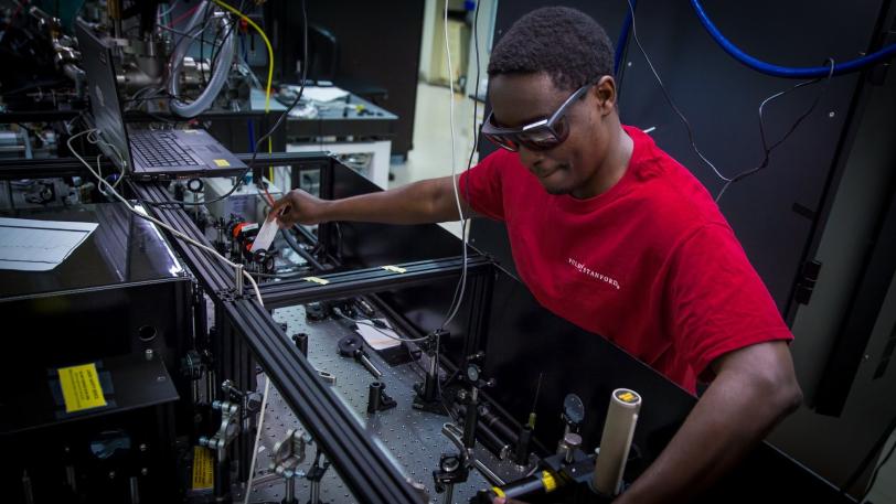 Stanford graduate student Georges Ndabashimiye in the PULSE Institute laser lab.