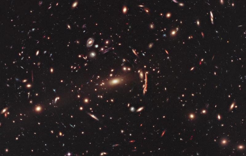 A cluster of bright galaxies on a black background.