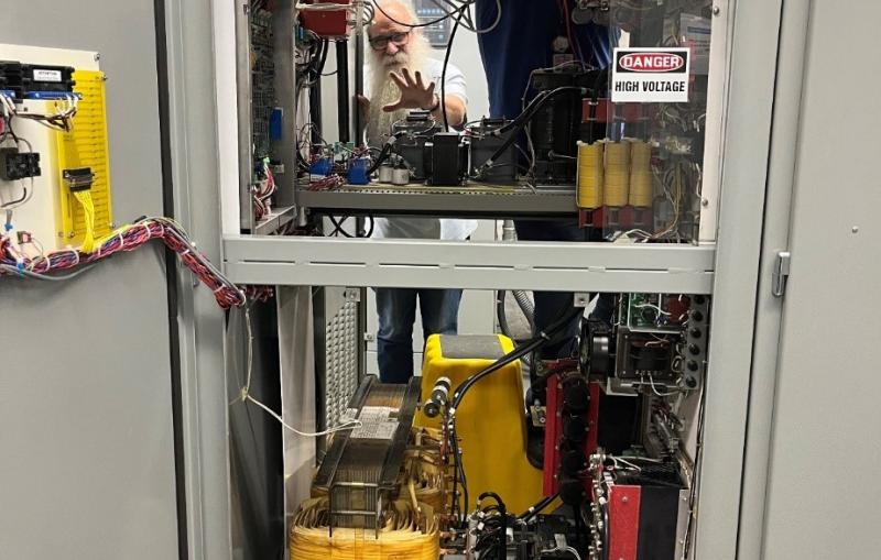 This photograph shows 2023 Lytle award winner Jim Sebek at work on SSRL's electrical systems.