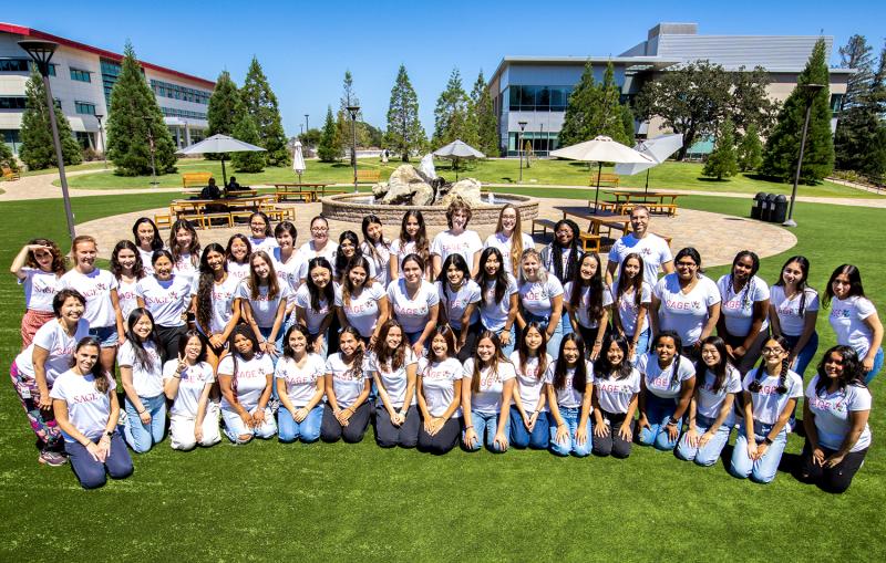 A group photo on a lawn on campus at SLAC.