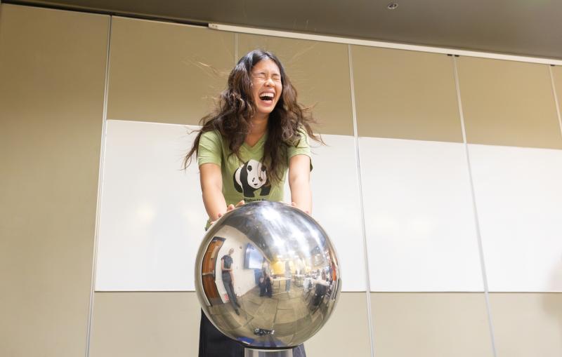 SAGE campers have fun experimenting with a Van de Graff generator