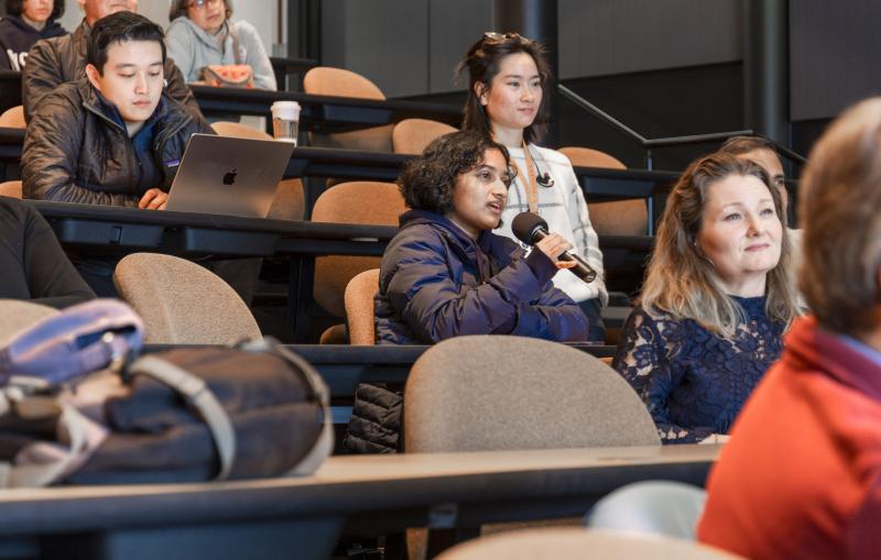 A public lecture audience member asks questions after Elizabeth Ryland's talk.