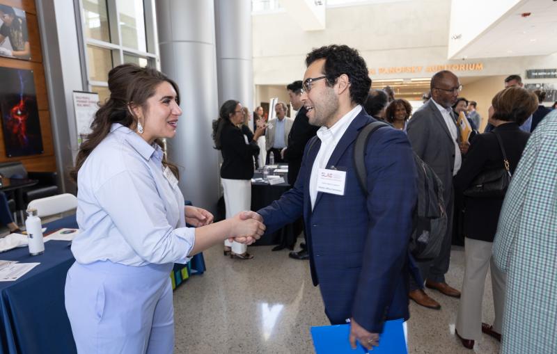 People greeting each other on SLAC's small business opportunity day