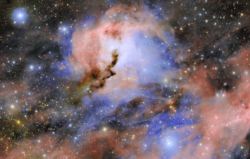 Blue and pink swirls against a starry black background
