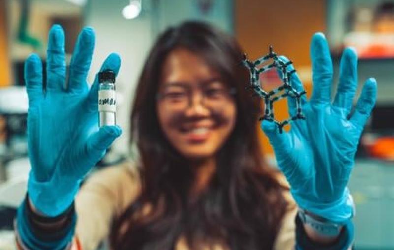 Scientist holding diamondoid molecule moldels