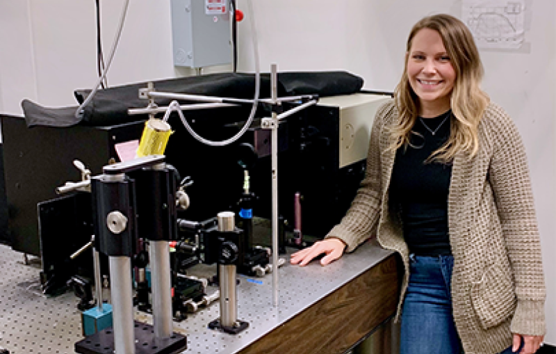 Hannah Rhoda with the resonance Raman spectroscopy equipment at Stanford