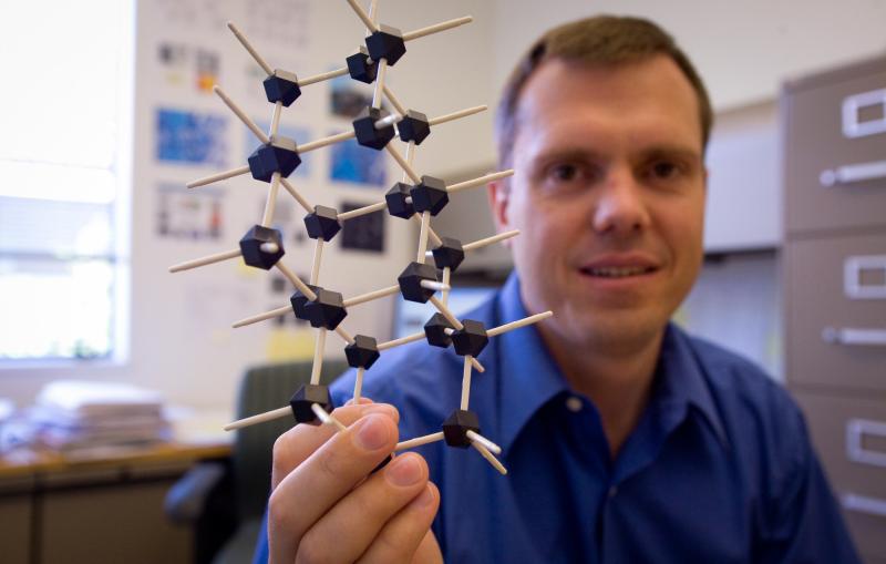 Nick Melosh holds a model of a diamondoid