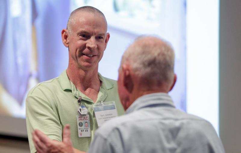 Image - Bart Johnson of SLAC's Stanford Synchrotron Radiation Lightsource is congratulated by X-ray science luminary Farrel W. Lytle after receiving an annual award. (SLAC National Accelerator Laboratory)