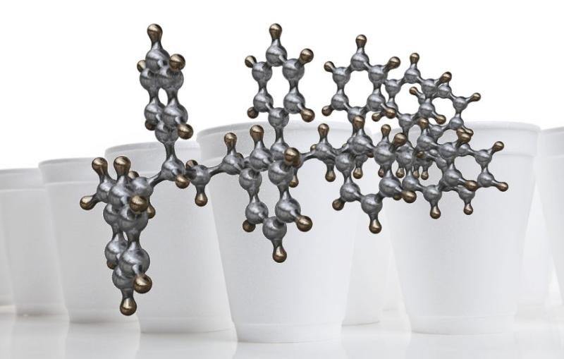Illustration of a polystrene molecular chain and Styrofoam cups, which are made of polystyrene.