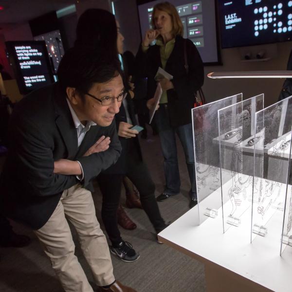 SLAC Lab Director Chi-Chang Kao looks over an exhibit at the 5th Life Art Science Technology Festival.