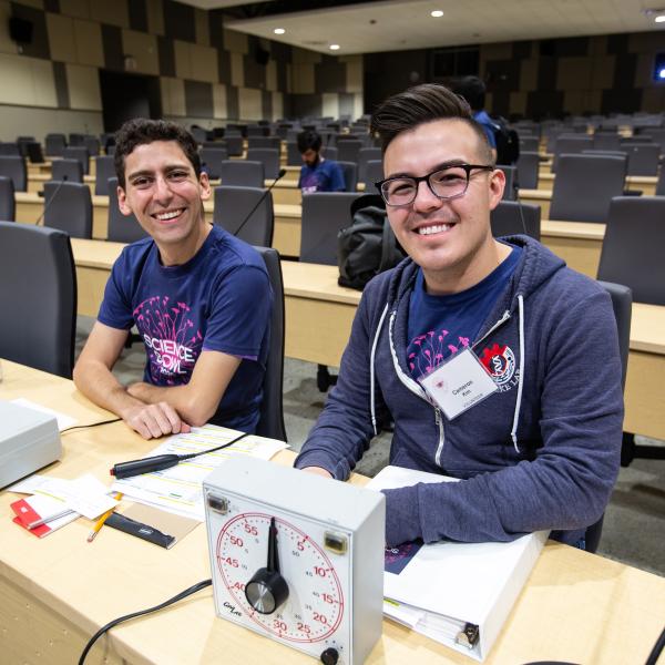 From left, Marc Davidson and Cameron Kim judge the final round of the 2020 Regional Department of Energy Science Bowl.
