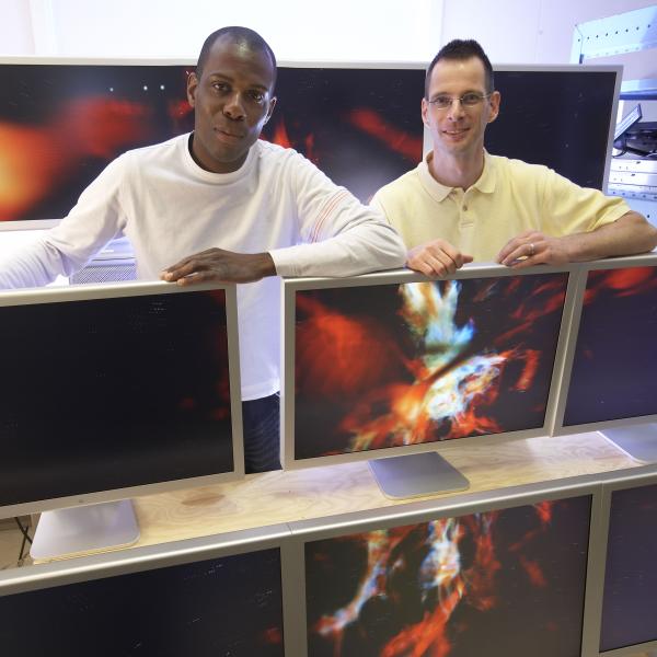 Adeyemi Adesanya,left, and Alf Wachsmann designed and built this multi-monitor array to showcase high-resolution playback of computer simulations