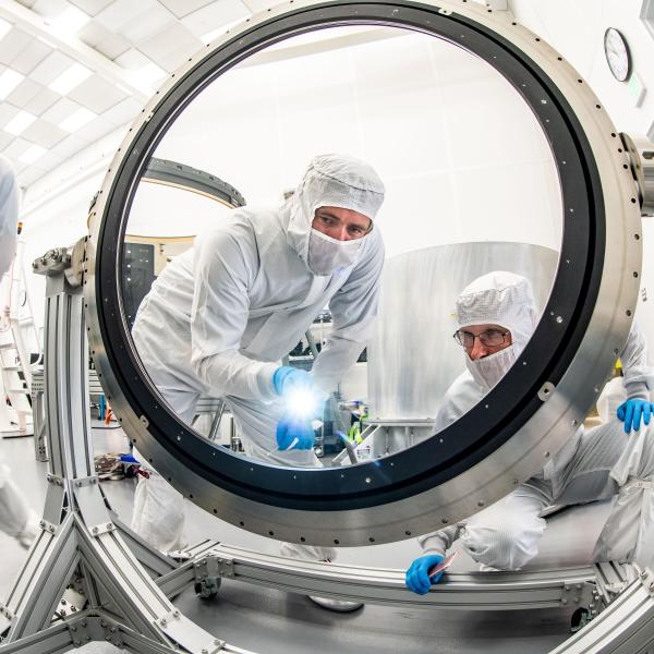  Justin Wolfe, from LLNL, standing left, and Travis Lange are inspecting the L3 lens