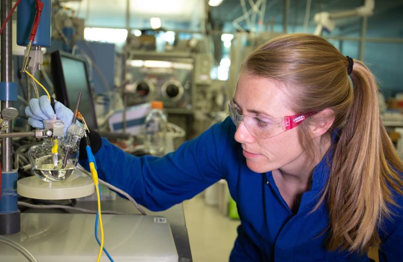Researcher with electrolyzer in SUNCAT lab