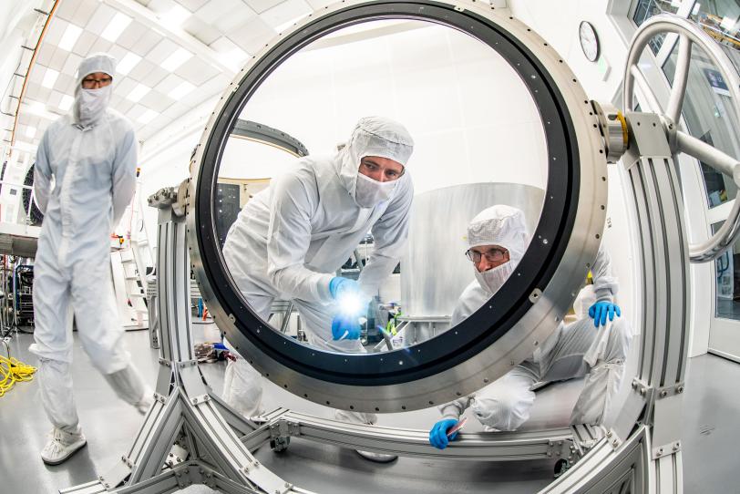  Justin Wolfe, from LLNL, standing left, and Travis Lange are inspecting the L3 lens