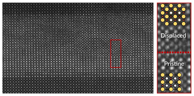 An electron microscope image of a superconducting nickelate material shows subtle defects in the arrangement of its atoms compared to an adjacent n area with no defects.