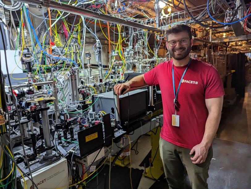 SLAC scientist Spencer Gessner stands inside FACET-II, where researchers work on plasma accelerator research and other techniques to make the next generation of accelerators.