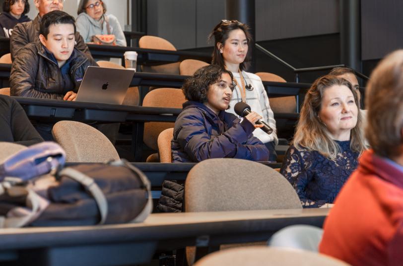A public lecture audience member asks questions after Elizabeth Ryland's talk.