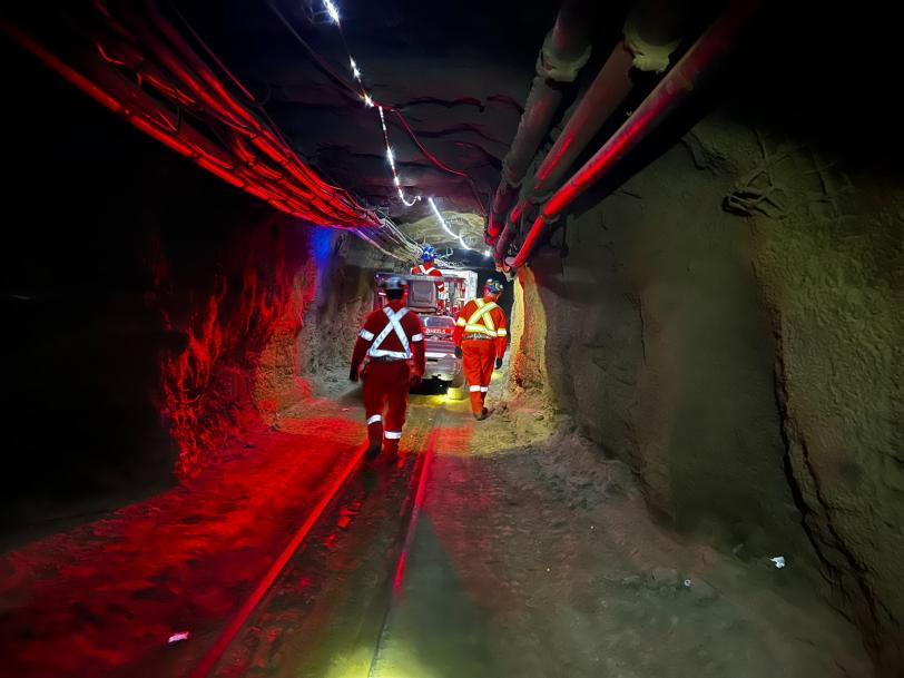 SNOLAB staff escort the SuperCDMS dilution fridge 1.2 kilometers through the mine drift to the lab entrance.