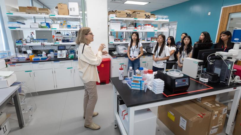 SLAC's Lydia-Marie Joubert leads students inside the labs at Arrillaga Science Center labs during a tour for SAGE campers at SLAC National Accelerator Laboratory. 