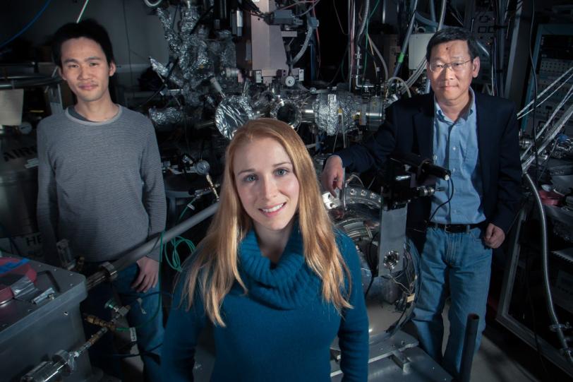 Photo - Scientists standing with equipment at SLAC.