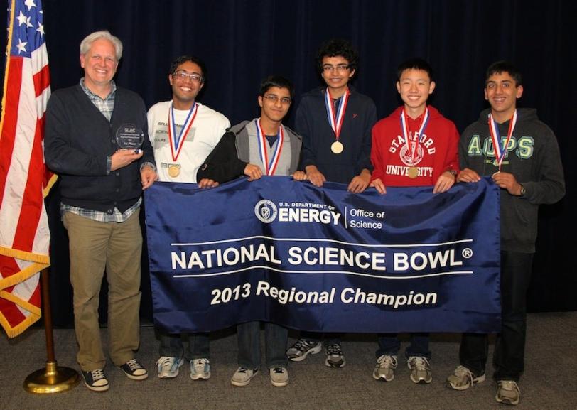 Photo - Group shot of students holding Science Bowl banner.