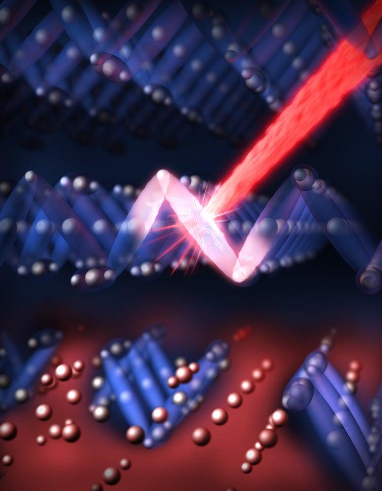Artists concept shows laser hitting atomic structure and breaking it