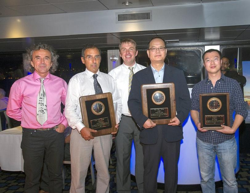 Photo - SLAC's Dao Xiang, at right, receives the 2013...