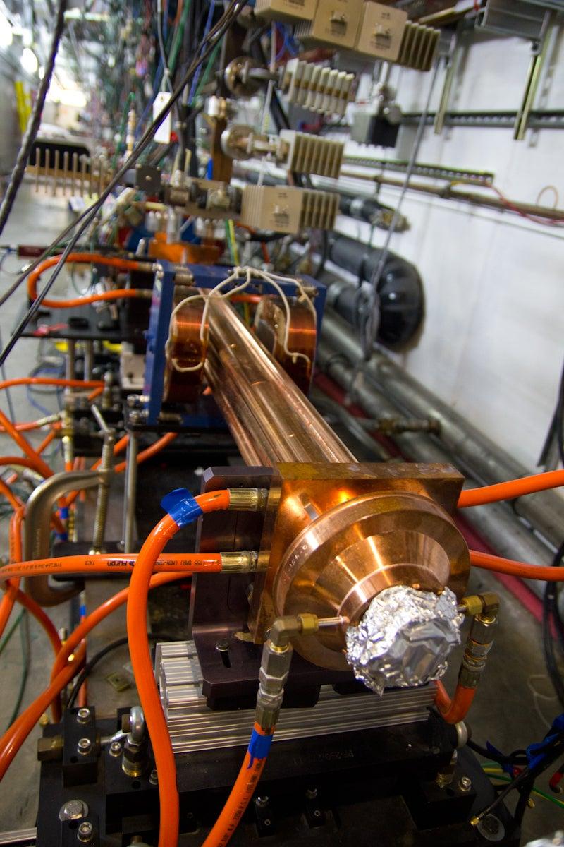 Image - This microwave undulator, designed and built at SLAC, uses microwave power and electrons to produce shorter-wavelength pulses, and is highly tunable compared to conventional undulators that use magnets. (Glenn Roberts Jr./SLAC)