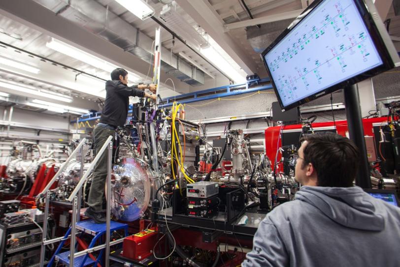 Image - Researchers prepare a membrane protein experiment at the Coherent X-ray Imaging (CXI) expeirmental station at SLAC's Linac Coherent Light Source X-ray laser. (SLAC National Accelerator Laboratory)
