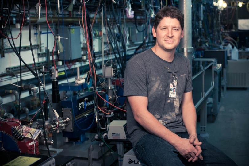 Accelerator physicist Erik Hemsing next to the NLCTA,...