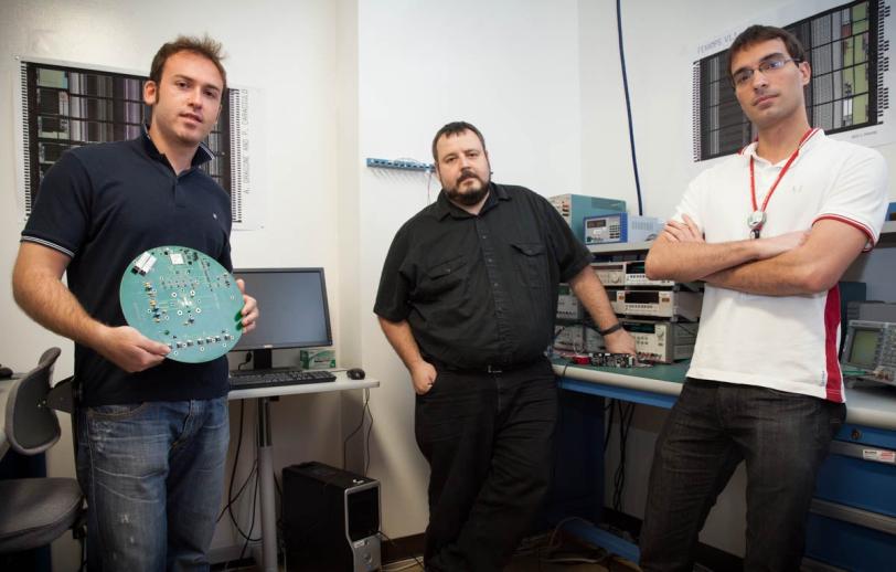 Photo - From left, Pietro Caragiulo, Angelo Dragone and Bojan Markovic of the SLAC Integrated Circuits Department. (Brad Plummer/SLAC)