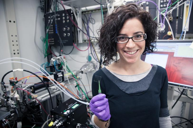 Lawrence Berkeley Lab chemist Anna Llordés with a sample of "smart" material for testing at SSRL Beam Line 11-3
