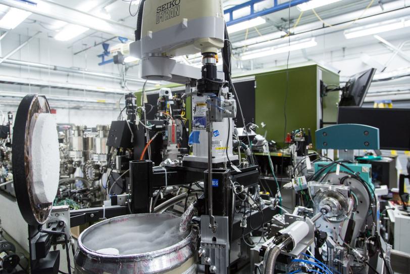 Image - This photograph shows equipment used in a highly automated X-ray crystallography system used at SLAC's Linac Coherent Light Source X-ray laser. The metal drum at lower left contains liquid nitrogen and is used to cool crystallized samples.