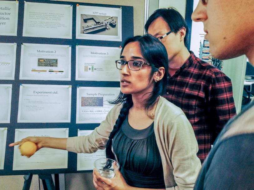 Archana Raja, a graduate student at Columbia University, explains her group’s poster presentation at SLAC’s Ultrafast X-ray Summer Seminar.