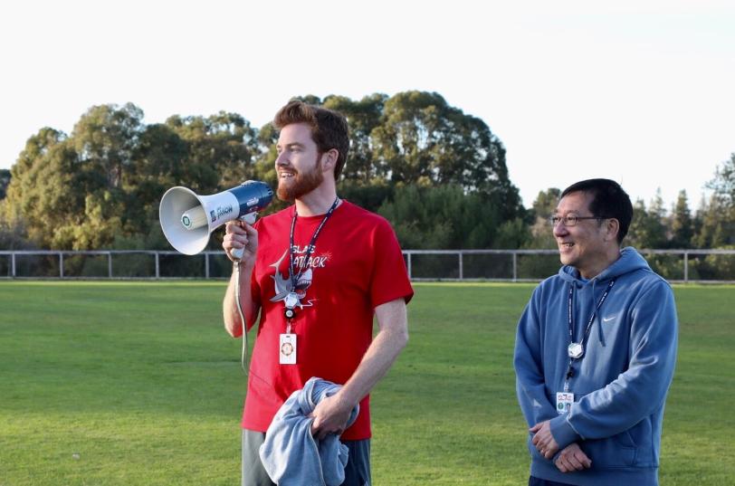 Andy Freeberg with a bull horn standing next to Chi-Chang Kao.