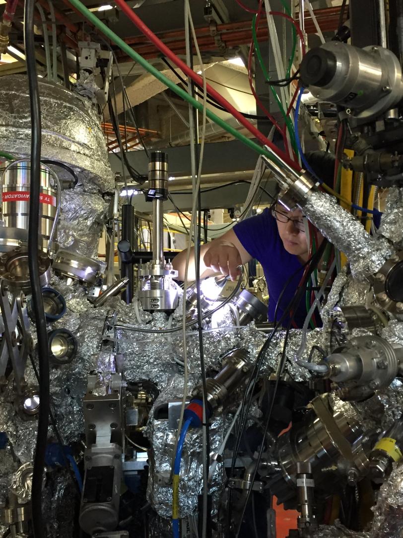 Ming Yi works on an instrument at the Advanced Light Source at Berkeley Lab.