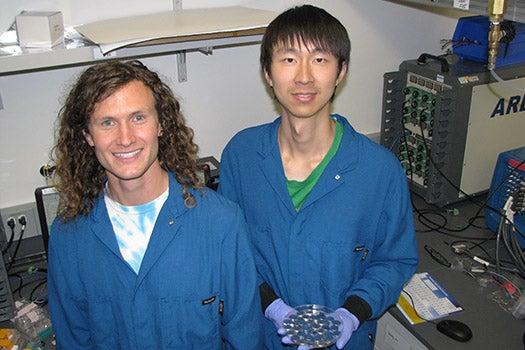 Stanford PhD students David Mackanic, left, and Zhiao Yu with their battery tester 