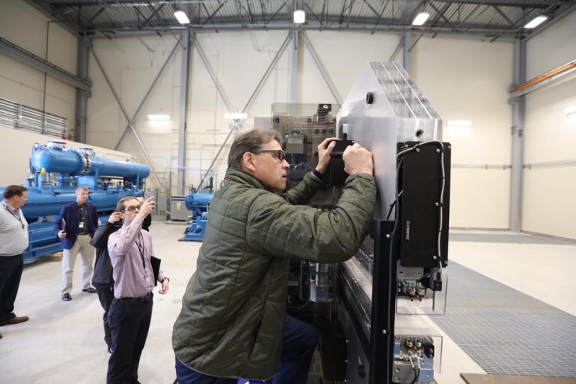 Secretary of Energy Rick Perry signs equipment at the LCLS-II cryoplant