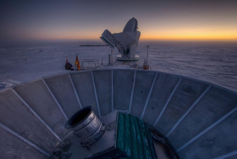 PHoto - The sun sets behind BICEP2 (in the foreground) and the South Pole Telescope (in the background). (Steffen Richter, Harvard University)