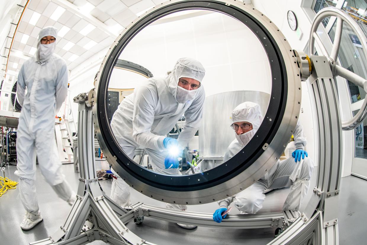  Justin Wolfe, from LLNL, standing left, and Travis Lange are inspecting the L3 lens