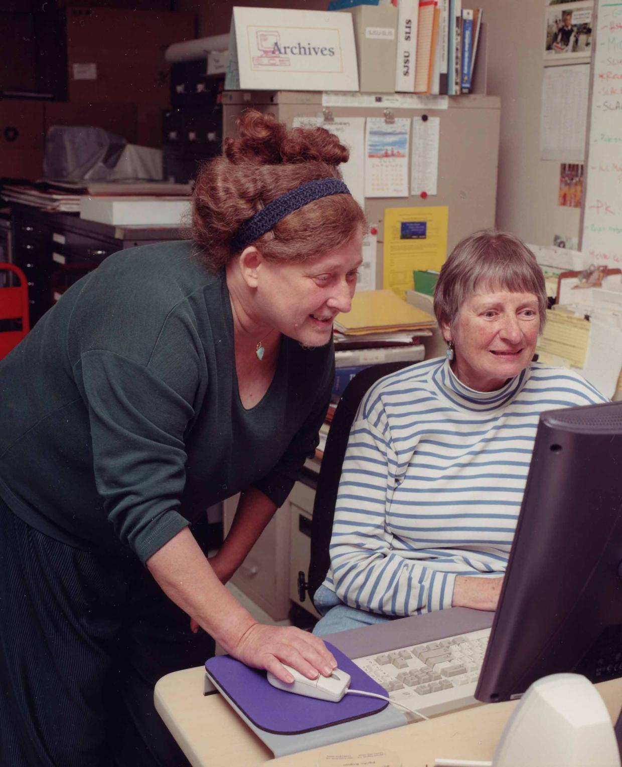 WWW Wizards Joan Winters and Louise Addis work together at a computer