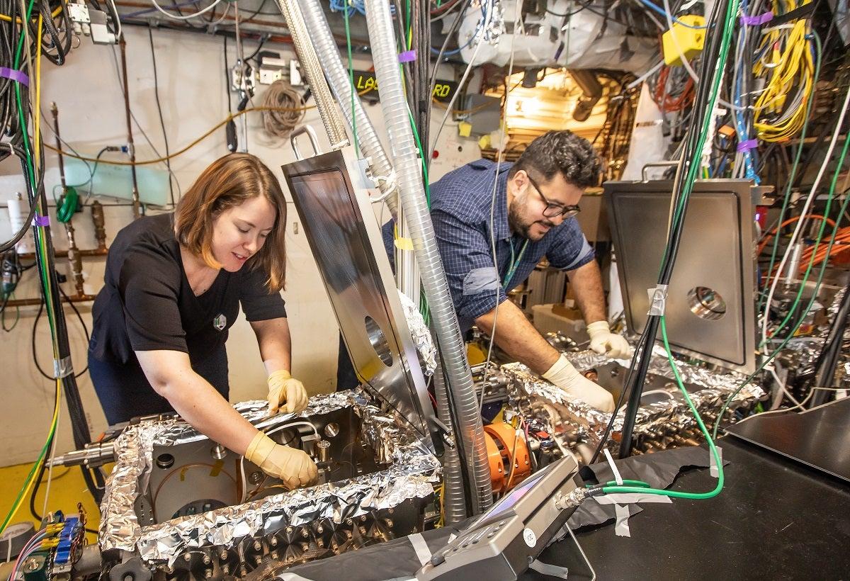 SLAC’s Emma Snively and Mohamed Othman at the lab’s high-speed “electron camera."