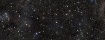Field of night sky with stars and galaxies
