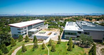 Science and User Support Building to the left and Arrillaga Science Center building to the right from above the Main Quad at SLAC's campus. 