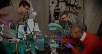 Stanford graduate students Robert Kasse, Natalie Geise and Tim Abate install an X-ray cell for battery research