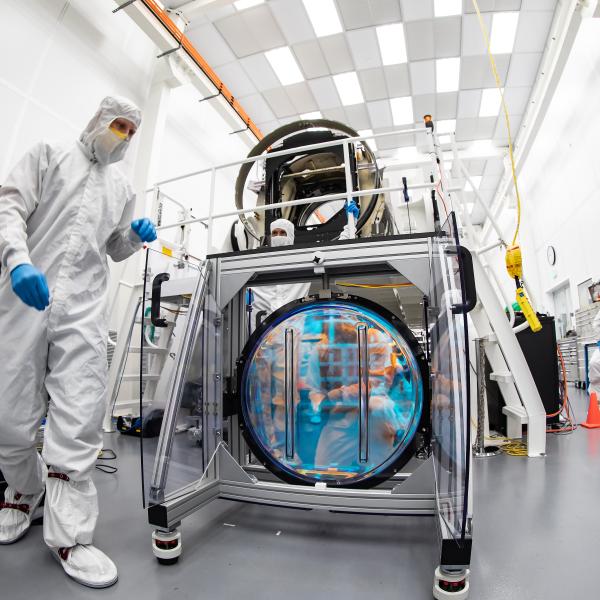SLAC's LSST team carefully unpack, examine, test and store the r-band filter.