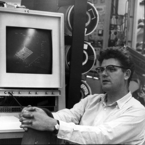 A 1967 photo of Richard Taylor in front of a computer monitor displaying experimental data. 